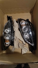 Faróis + Apoios de pára-choques Mazda 3 Bk 2008